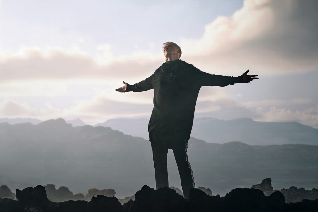 BM of KARD stands on a car in scenic Iceland during his "Broken Me" Music video produced by 8Pex and Vive studios