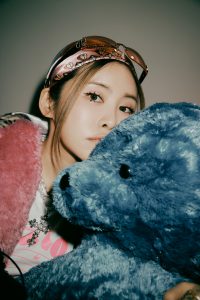 Korean singer-songwriter posing for a photo for her new song "Blanket"