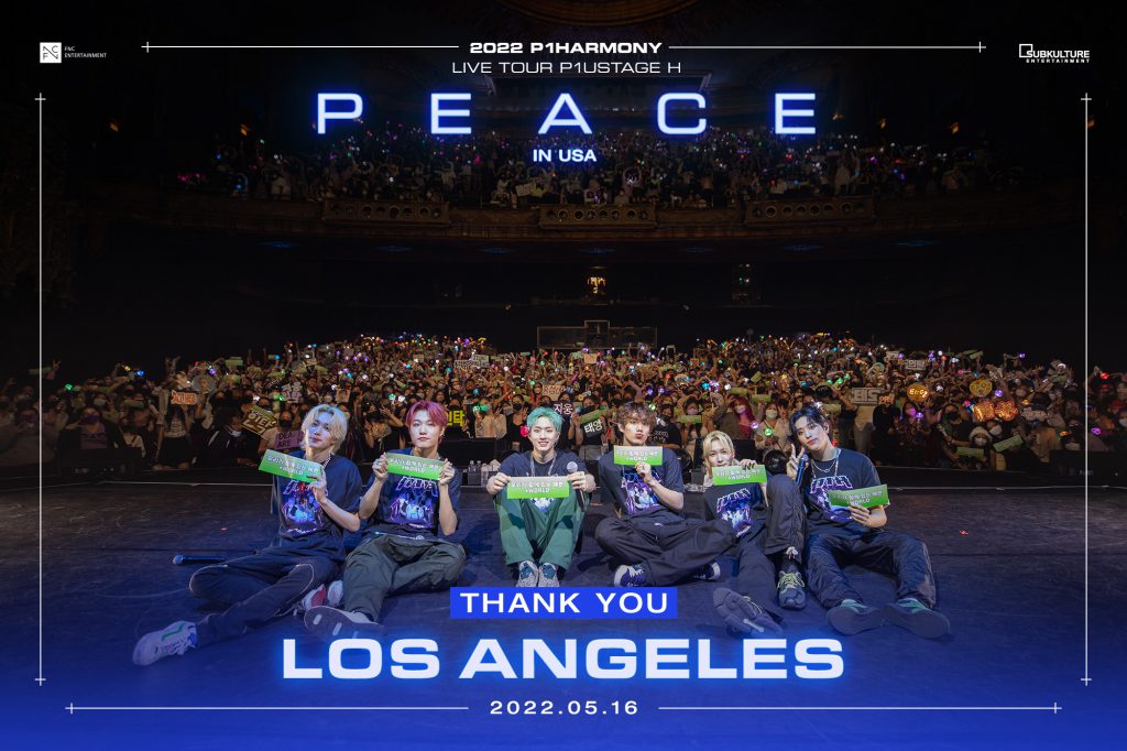 P1Harmony taking a group photo with fans at their Los Angeles concert at The Theatre at Ace Hotel